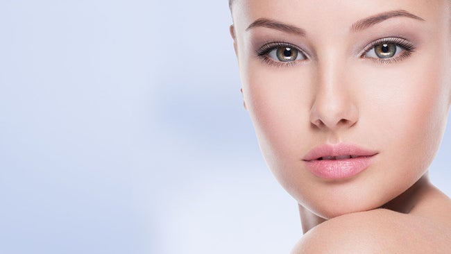 Beautiful face of young woman with perfect health fresh skin